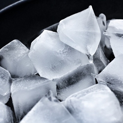 ice cubes against a black background